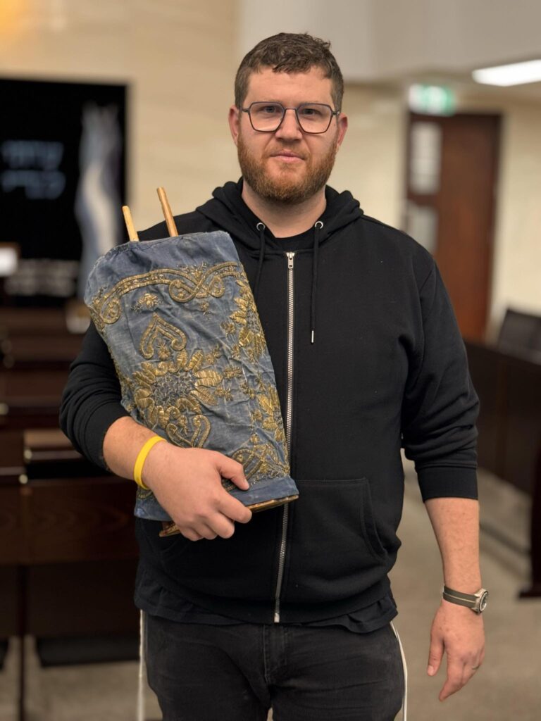 Rabbi Dan Lieberman with the Torah given to Rabbi Freedman in Alexandria, Egypt