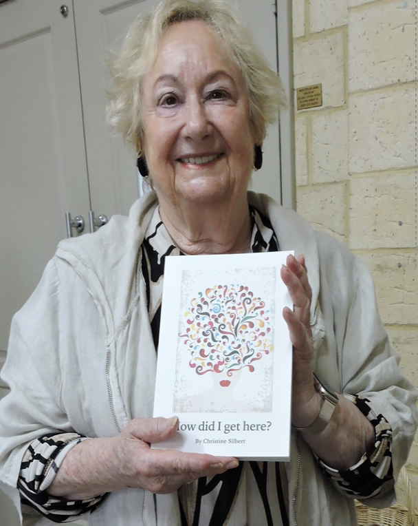 Christine Silbert with her book, 'How Did I Get Here?'